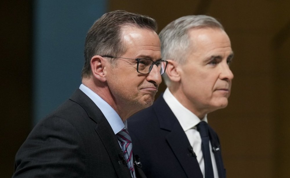 Bloc Quebecois Leader Yves-Francois Blanchet and Liberal Leader Mark Carney leave the stage following the English-language federal leaders' debate in Montreal, Thursday, April 17, 2025. THE CANADIAN PRESS/Adrian Wyld