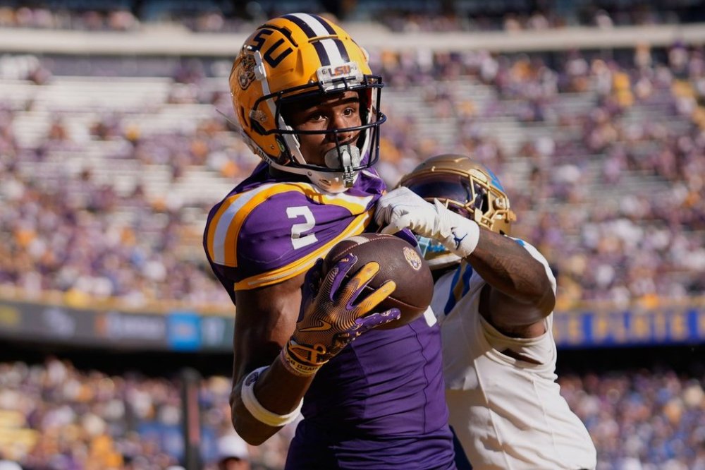 FILE - LSU wide receiver Kyren Lacy (2) tries to pull in a pass in the end zone as he is covered by UCLA defensive back Jaylin Davies in the second half of an NCAA college football game in Baton Rouge, La., Saturday, Sept. 21, 2024. (AP Photo/Gerald Herbert, File)
