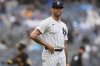 FILE - New York Yankees' Luis Gil reacts as Pittsburgh Pirates' Jared Triolo runs the bases after hitting a two-run home run during the sixth inning of a baseball game, Sept. 28, 2024, in New York. (AP Photo/Frank Franklin II, File)