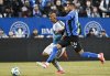 CF Montréal defender George Campbell (24) challenges  /Charlotte FC forward Idan Toklomati (17) during second half MLS soccer action in Montreal, Saturday, April 12, 2025. THE CANADIAN PRESS/Graham Hughes