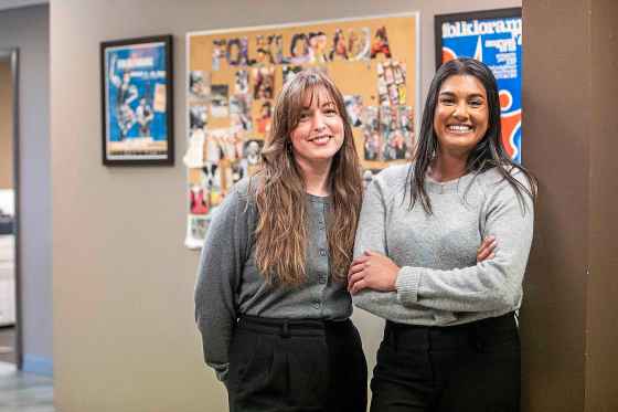 Folklorama's manager of group tour programs Courtney Horwood (left) and volunteer Sara Sambanthan at the Folklorama offices downtown. (Mikaela MacKenzie / Free Press)