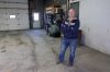 Farmer Dean Toews stands beside the tread-marks left from his all-terrain vehicle that burglars drove off his property on Sunday morning. (Connor McDowell / Brandon Sun)