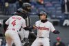 Cleveland Guardians' Steven Kwan, right, is greeted by Brayan Rocchio (4) in front of Chicago White Sox catcher Matt Thaiss, rear, after hitting a home run in the third inning of a baseball game in Cleveland, Thursday, April 10, 2025. (AP Photo/Sue Ogrocki)