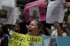 The relatives of Venezuelan migrants in the U.S. who were flown to a prison in El Salvador by the U.S. government who alleged they were members of the Tren de Aragua gang, protest outside of the United Nations building in Caracas, Venezuela, Wednesday, April 9, 2025. (AP Photo/Ariana Cubillos)