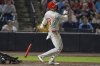Philadelphia Phillies' Nick Castellanos (8) watches his three-run home run off Tampa Bay Rays pitcher Mason Englert during the eighth inning of a baseball game Tuesday, May 6, 2025, in Tampa, Fla. (AP Photo/Chris O'Meara)