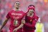 Liverpool's Trent Alexander-Arnold, left, and Curtis Jones celebrate after winning the English Premier League soccer match between Liverpool and Tottenham Hotspur and clinching the Premier League title at Anfield in Liverpool, England, Sunday, April 27, 2025. (AP Photo/Jon Super)