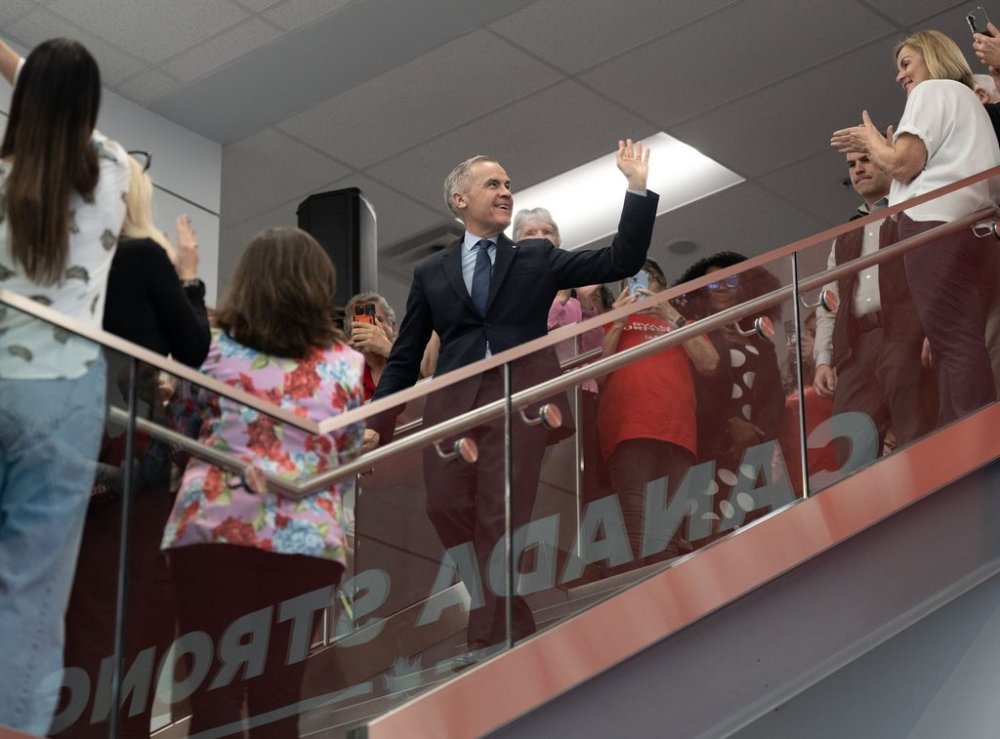 Liberal Leader Mark Carney waves as he arrives to announce the release of his party's election platform during a federal election campaign stop in Whitby, Ont., on Saturday, April 19, 2025. THE CANADIAN PRESS/Christinne Muschi