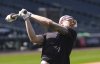 Colorado Rockies right field prospect Zac Veen, who was called up from Triple-A affiliate Albuquerque, warms up before appearing in his first Major League Baseball game against the Milwaukee Brewers, Tuesday, April 8, 2025, in Denver. (AP Photo/David Zalubowski)