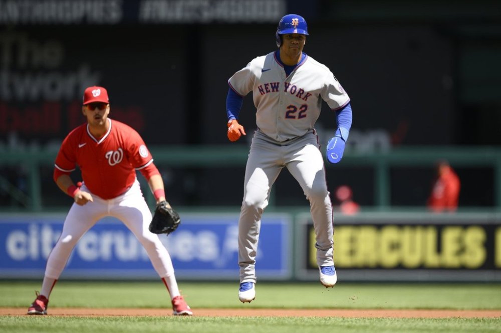 New York Mets' Juan Soto (22) takes a lead from first base in front of Washington Nationals first baseman Nathaniel Lowe, left, during the first inning of a baseball game, Sunday, April 27, 2025, in Washington. (AP Photo/Nick Wass)