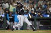 Miami Marlins' Agustín Ramírez hits a two-run home run on a pitch from Seattle Mariners pitcher Casey Lawrence during the eighth inning of of a baseball game, Friday, April 25, 2025, in Seattle. (AP Photo/John Froschauer)