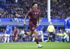 Manchester City's Nico O'Reilly celebrates scoring during the English Premier League soccer match between Everton and Manchester City at Goodison Park, Liverpool, England, Saturday April 19, 2025. (Peter Byrne/PA via AP)