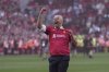 Liverpool's manager Arne Slot celebrates after winning the English Premier League soccer match between Liverpool and Tottenham Hotspur and clinching the Premier League title at Anfield in Liverpool, England, Sunday, April 27, 2025. (AP Photo/Jon Super)