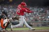Cincinnati Reds catcher Jose Trevino (35) hits into a fielder's choice scoring Spencer Steer in the third inning of a baseball game against the San Francisco Giants in San Francisco, Tuesday, April 8, 2025. (AP Photo/Scot Tucker)