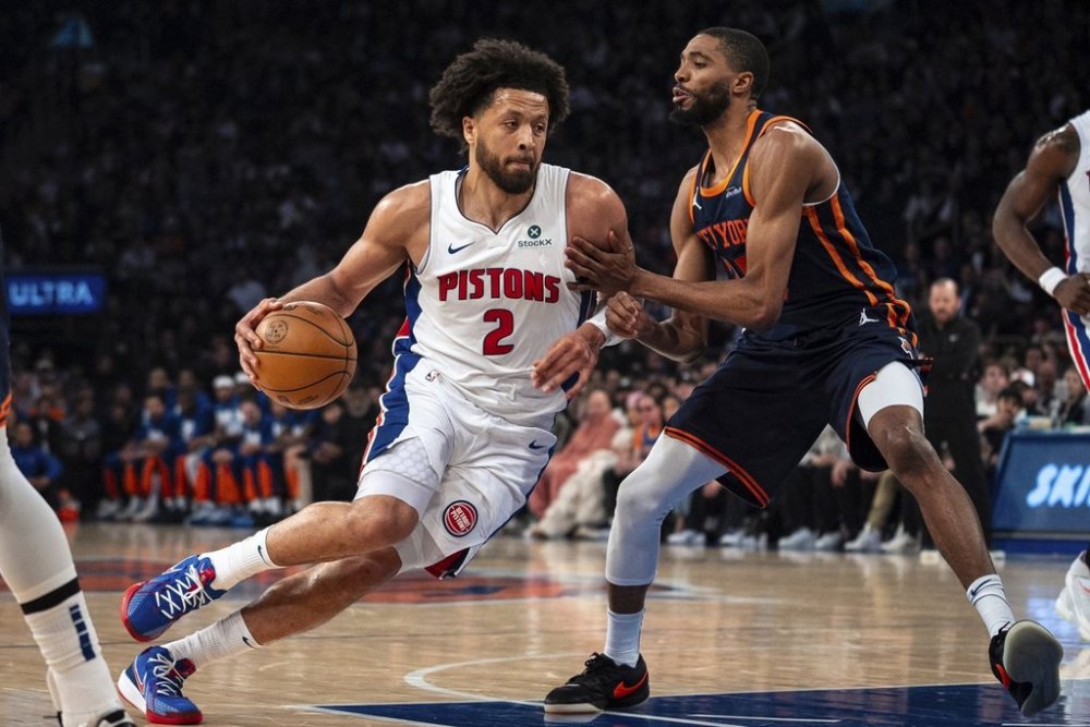 Detroit Pistons guard Cade Cunningham (2) drives toward the basket against New York Knicks' Mikal Bridges during the first half of Game 2 of an NBA basketball first-round playoff series, Monday, April 21, 2025, in New York. (AP Photo/Angelina Katsanis)