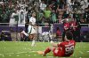 Al Ahli's Wenderson Galeno, left, celebrates after scoring his side's opening goal as Kawasaki Flontale's goalkeeper Louis Takaji Yamaguchi reacts after he fails to save the ball during to the AFC Champions League Elite final soccer match between Kawasaki Flontale and Al Ahli at Alinma Stadium in Jeddah, Saudi Arabia, Saturday, May 3, 2025. (AP Photo/Ali Issa)