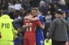 Leicester's Jamie Vardy hugs with Liverpool's Mohamed Salah at the end of the English Premier League soccer match between Leicester City and Liverpool at King Power stadium in Leicester, England, Sunday, April 20, 2025. (AP Photo/Rui Vieira)
