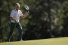 Bernhard Langer, of Germany, waves to the gallery on the 18th green during the second round at the Masters golf tournament, Friday, April 11, 2025, in Augusta, Ga. (AP Photo/George Walker IV)