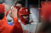 Philadelphia Phillies designated hitter Kyle Schwarber (12) cel;ebrates his solo homer against the Atlanta Braves in the fifth inning of a baseball game, Tuesday, April 8, 2025, in Atlanta. (AP Photo/Mike Stewart)