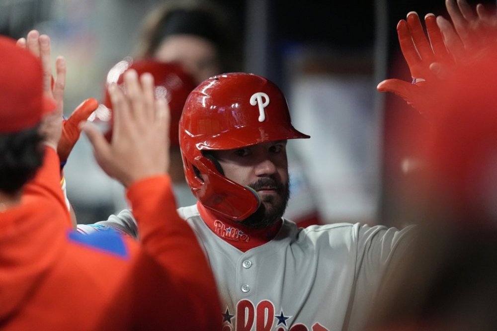 Philadelphia Phillies designated hitter Kyle Schwarber (12) cel;ebrates his solo homer against the Atlanta Braves in the fifth inning of a baseball game, Tuesday, April 8, 2025, in Atlanta. (AP Photo/Mike Stewart)