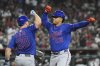 New York Mets' Juan Soto (22) celebrates his home run against the Arizona Diamondbacks with Mets' Pete Alonso (20) during the sixth inning of a baseball game Wednesday, May 7, 2025, in Phoenix. (AP Photo/Ross D. Franklin)