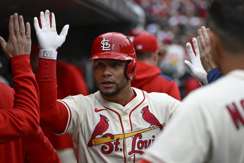 St. Louis Cardinals' Willson Contreras, center, is congratulated by teammates after hitting a solo home run in the second inning during the first baseball game of a doubleheader against the New York Mets, Sunday, May 4, 2025, in St. Louis. (AP Photo/Joe Puetz)