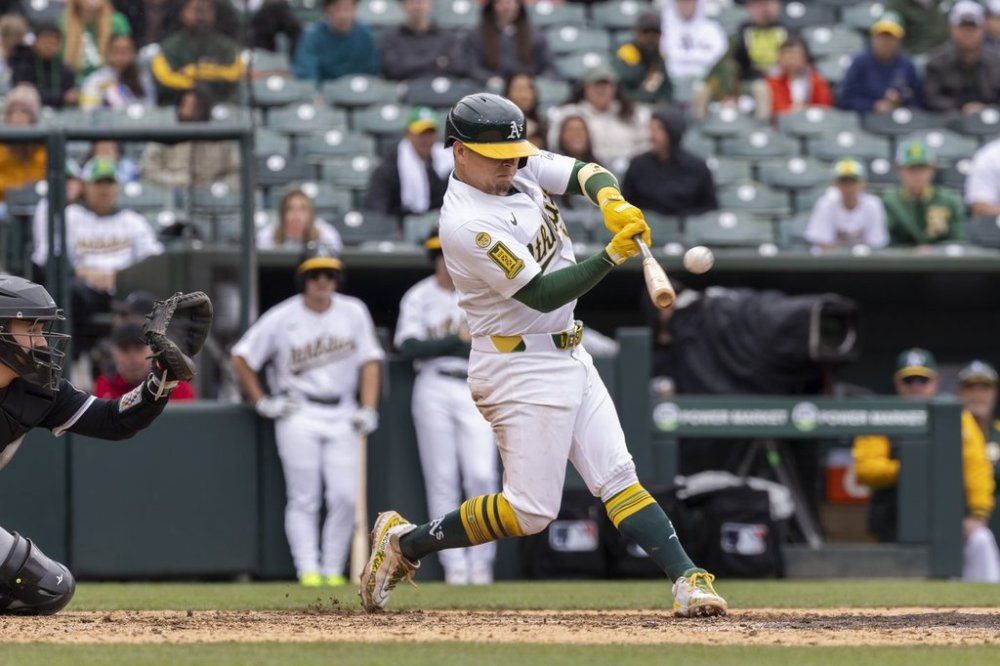 Athletics' Luis Urías (17) hits a walk-off home run during the 10th inning of a baseball game against the Chicago White Sox, Sunday, April 27, 2025, in West Sacramento, Calif. (AP Photo/Sara Nevis)