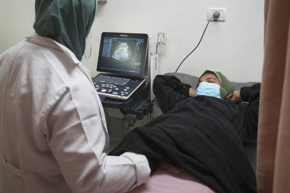 Pregnant Palestinian woman Yasmine Siam undergoes an ultrasound scan at Nasser Hospital in Khan Younis, in the southern Gaza Strip, Wednesday, April 9, 2025. She suffered a miscarriage a few days later. (AP Photo/Abdel Kareem Hana)