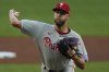 Philadelphia Phillies pitcher Zack Wheeler (45) deleivers against the Atlanta Braves in the first inning of a baseball game, Tuesday, April 8, 2025, in Atlanta. (AP Photo/Mike Stewart)