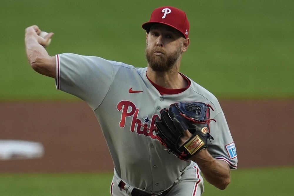 Philadelphia Phillies pitcher Zack Wheeler (45) deleivers against the Atlanta Braves in the first inning of a baseball game, Tuesday, April 8, 2025, in Atlanta. (AP Photo/Mike Stewart)