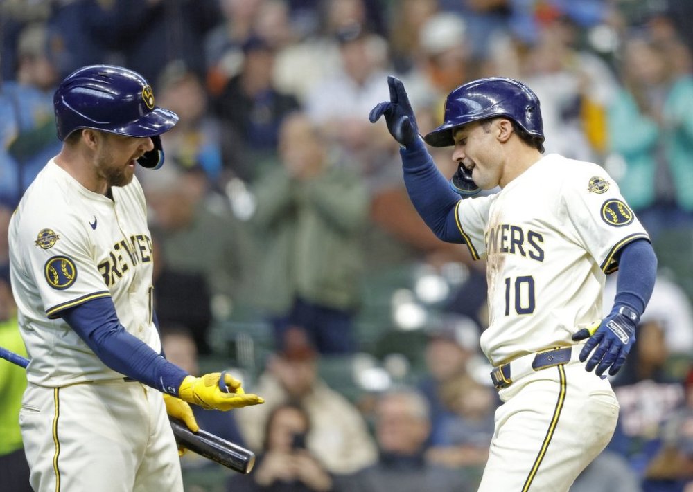 Milwaukee Brewers' Sal Frelick (10) reacts with Rhys Hoskins after Felick's home run against the Detroit Tigers during the sixth inning of a baseball game, Wednesday, April 16, 2025, in Milwaukee. (AP Photo/Jeffrey Phelps)