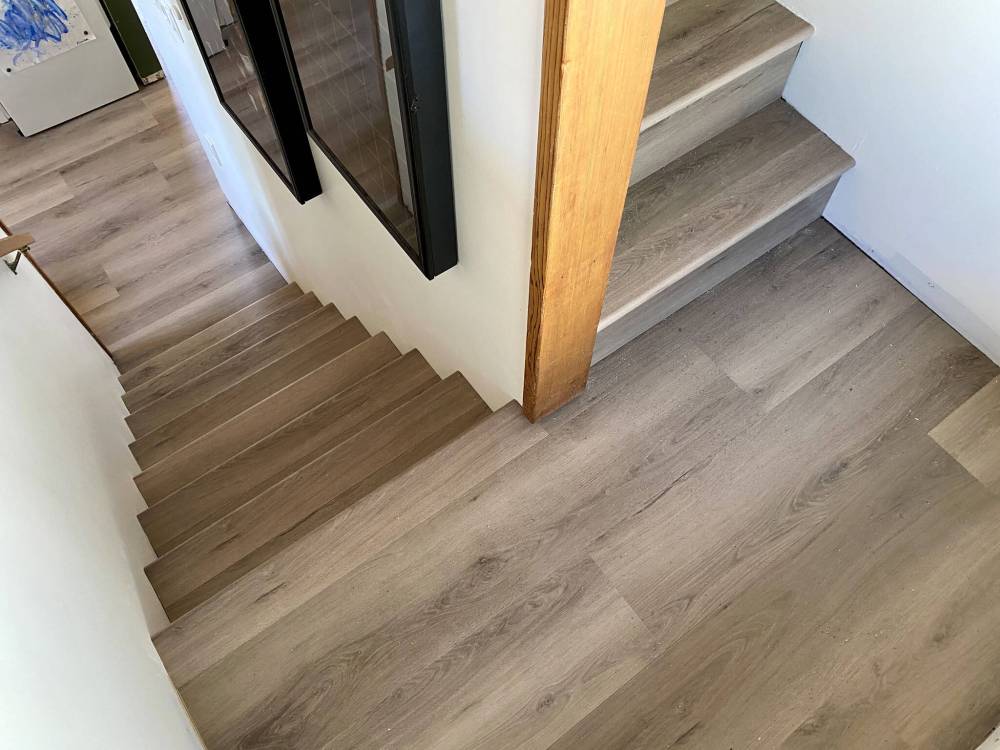 MARC LABOSSIERE / FREE PRESS
Vinyl-plank flooring and nosing are installed along the staircase to match the newly installed vinyl throughout the rest of the house.