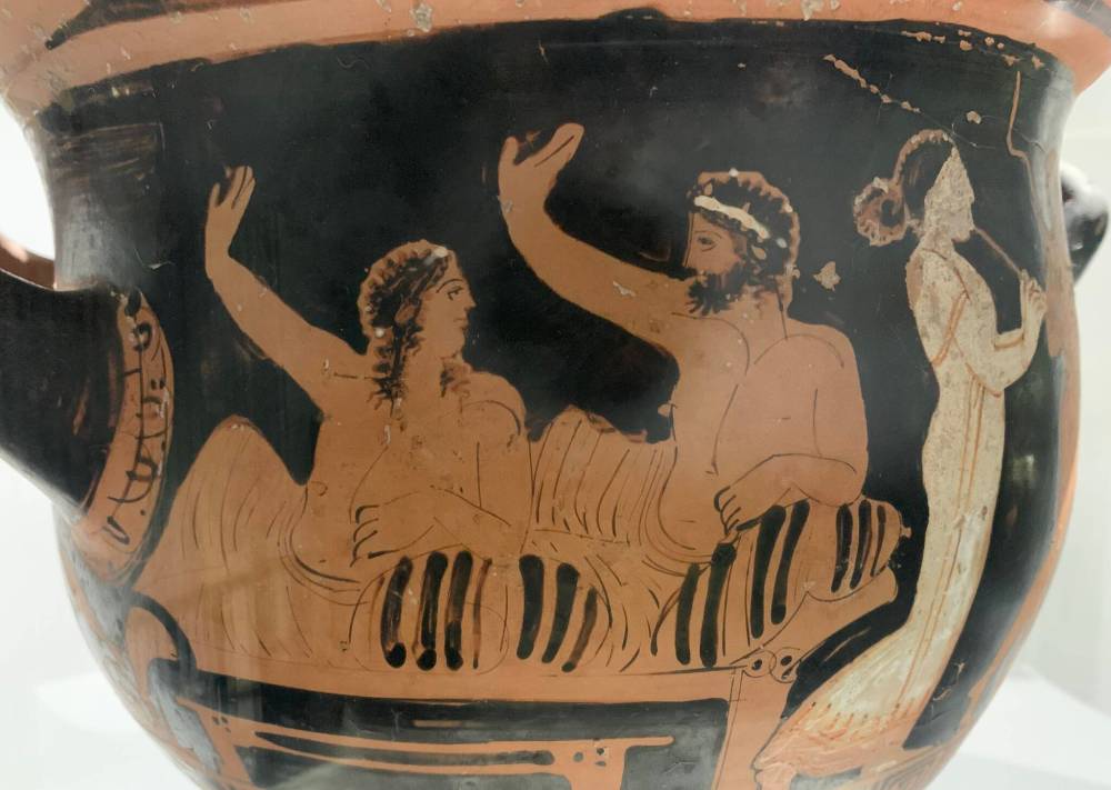 Pam Frampton photo
A musician entertains as a couple relaxes on a divan on a piece of ancient pottery.