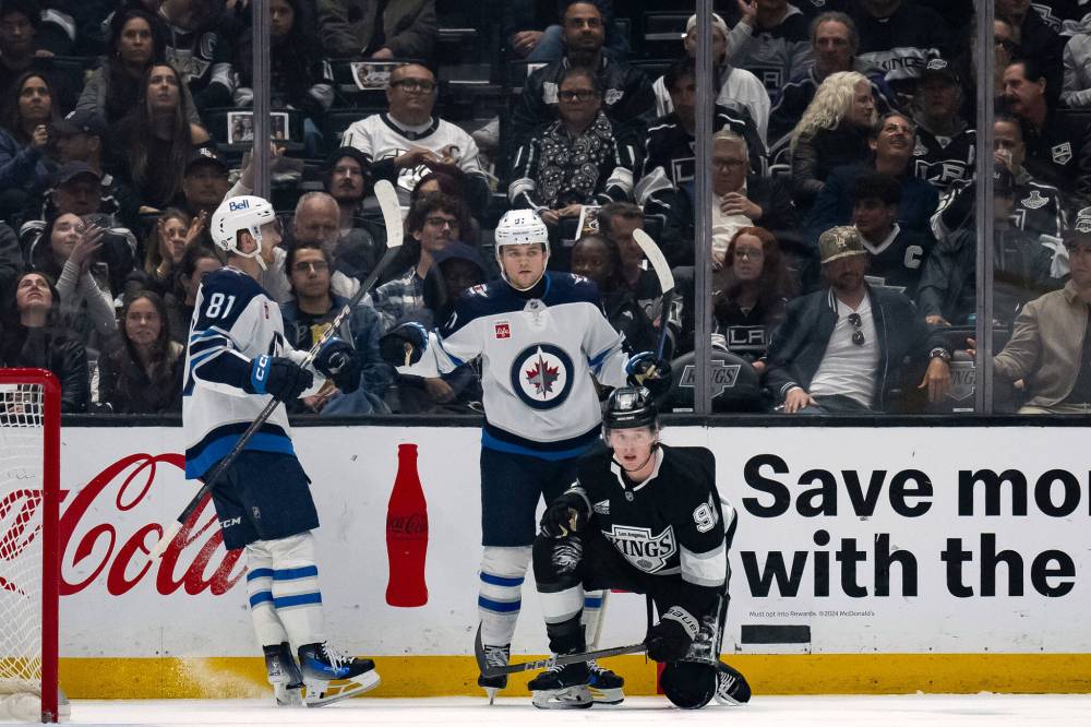 Cole Perfetti celebrates his goal with left wing Kyle Connor (81) during the second period of the game against the Los Angeles Kings on Tuesday in Los Angeles. (Kyusung Gong / The Associated Press)