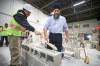 Federal NDP leader Jagmeet Singh learns to lay bricks with the help of student Greg Wood during tour of the training facility at Manitoba Building Trades Institute after Singh’s news conference Wednesday.