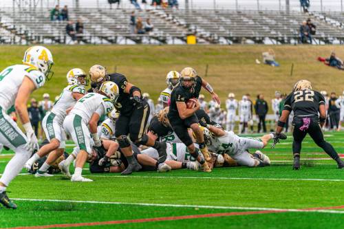 ADRIEN B. PHOTOGRAPHY
                                Manitoba quarterback Jackson Tachinski takes off on another run Saturday. He fiinished with a career-high ??? yards.