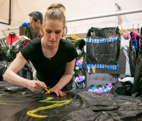 BROOK JONES/FREE PRESS
                                Voices alumni and dress designer Brittany-Morgan Erb paints a garbage bag dress for the Voices: Manitoba’s Youth in Care Network fundraiser.