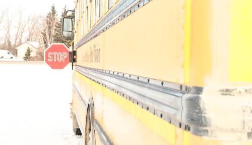 ALEX LAMBERT THE CARILLON An SRSD school bus extends its stop sign to halt drivers so it can safely drop children off. Transport Canada is mandating cameras around buses for all new school buses by late 2027.