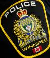 Photo of a Winnipeg Police Service shoulder badge on an officer in Winnipeg on November 5, 2019. A Manitoba RCMP officer who is alleged to have left his duty belt and firearm behind a receptionist’s desk while at a physiotherapy appointment will not be charged with careless storage of a firearm. The Independent Investigation Unit says the officer went to the appointment in November 2019 in Winnipeg. THE CANADIAN PRESS/John Woods