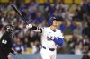 Los Angeles Dodgers' Shohei Ohtani watches his ball go out for a solo home run during the first inning of a baseball game against the Colorado Rockies Wednesday, April 16, 2025, in Los Angeles. (AP Photo/Mark J. Terrill)