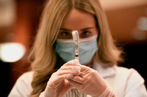 Jessica Hill / Associated Press files
                                In this March 2021 photo, a pharmacist draws a syringe of Johnson & Johnson COVID-19 vaccine at Hartford Hospital in Hartford, Conn.