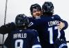 John Woods / THE CANADIAN PRESS
                                Alex Iafallo (left), Mark Scheifele and Adam Lowry celebrate Monday after Lowry’s insurance marker against the St. Louis Blues.