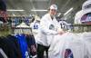 Ruth Bonneville / Free Press
                                Matthew Baragar, manager of Royal Sports on Pembina, with racks of whiteout clothing they just ordered for the upcoming NHL playoffs.