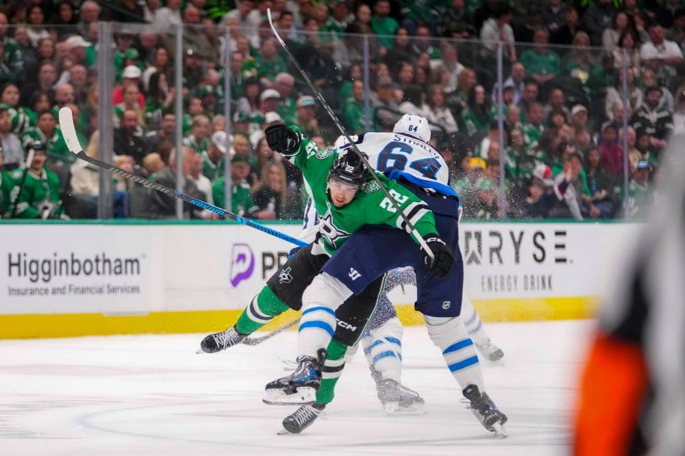 Julio Cortez / The Associated Press
Dallas Stars centre Mavrik Bourque and Winnipeg Jets defenceman Logan Stanley collide during the second period.