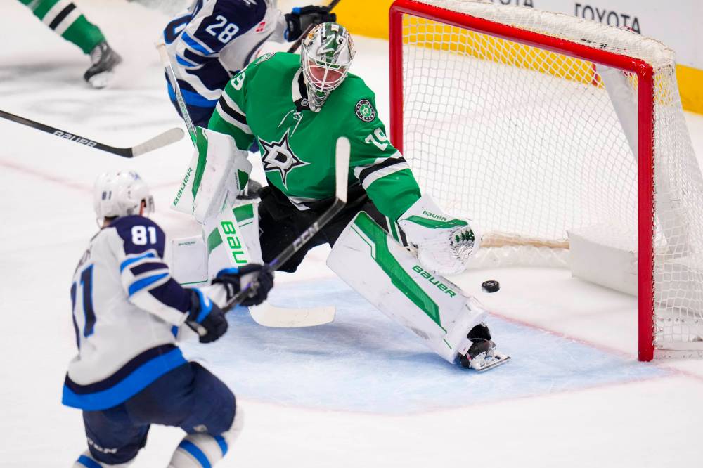 Julio Cortez / The Associated Press
Winnipeg Jets left wing Kyle Connor scores a goal on Dallas Stars goaltender Jake Oettinger during the third period.