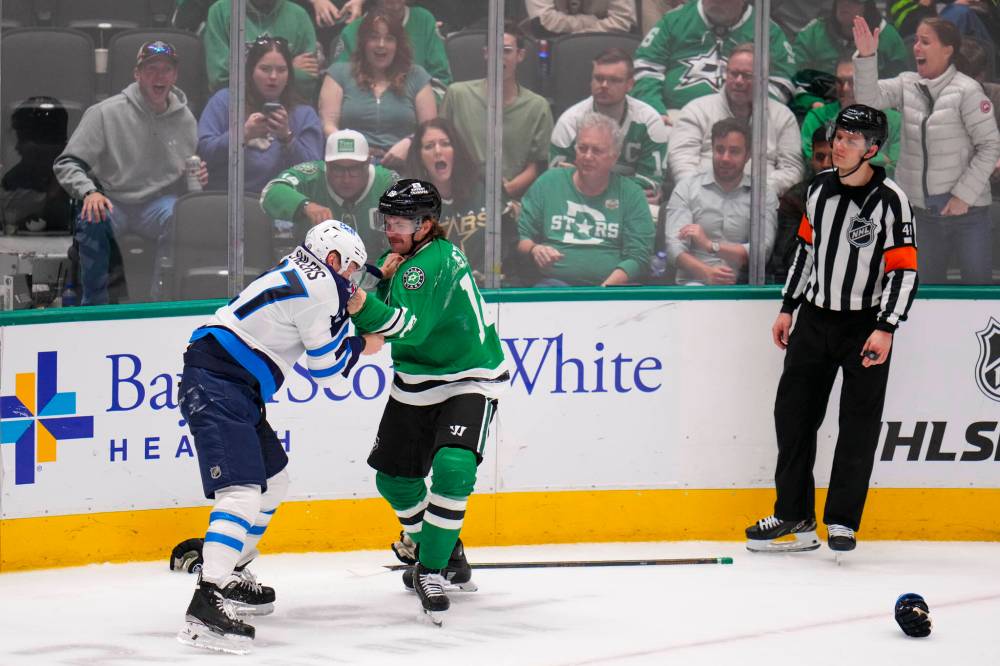 Julio Cortez / The Associated Press
Winnipeg Jets left wing Nikolaj Ehlers and Dallas Stars centre Sam Steel fight during the third period.