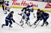 FRED GREENSLADE / THE CANADIAN PRESS
                                Edmonton Oilers’ Connor McDavid (97) passes the puck as he is surrounded by Winnipeg Jets’ Kyle Connor (81), Logan Stanley (64), Mark Scheifele (55) and Alex Iafallo (9) during the first period NHL action in Winnipeg, Sunday April 13 2025.