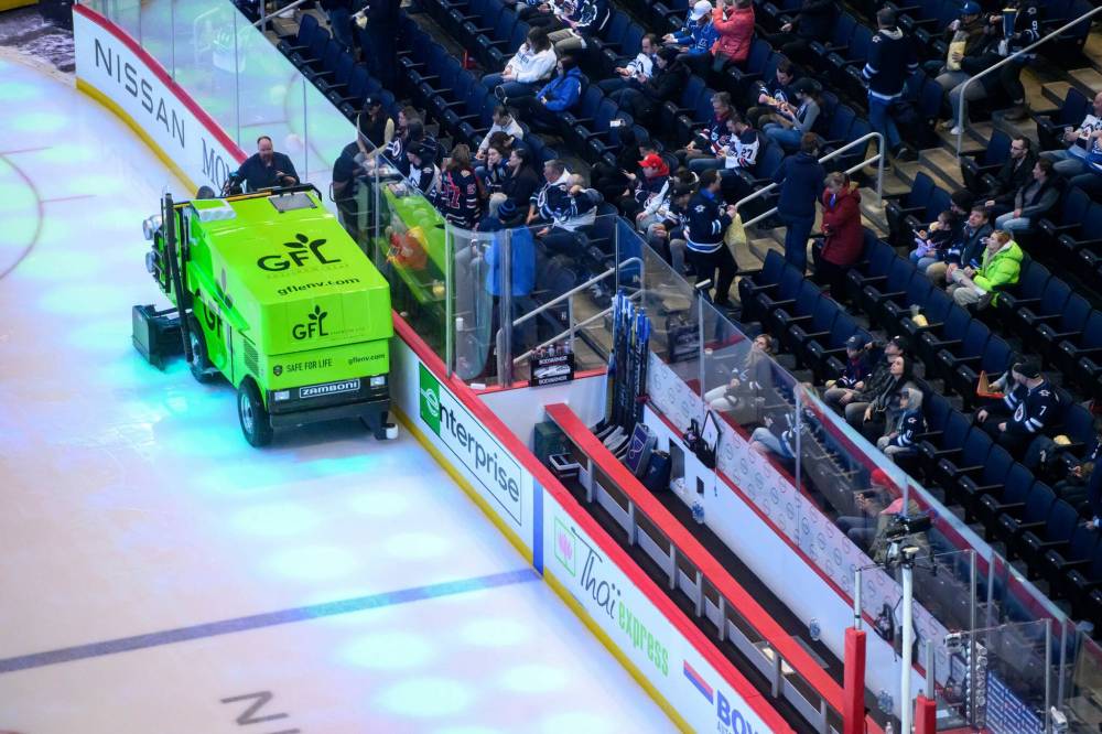 MIKE SUDOMA / FREE PRESS
Zamboni operator Chucky clears the ice in between periods at Canada Life Centre Monday night.