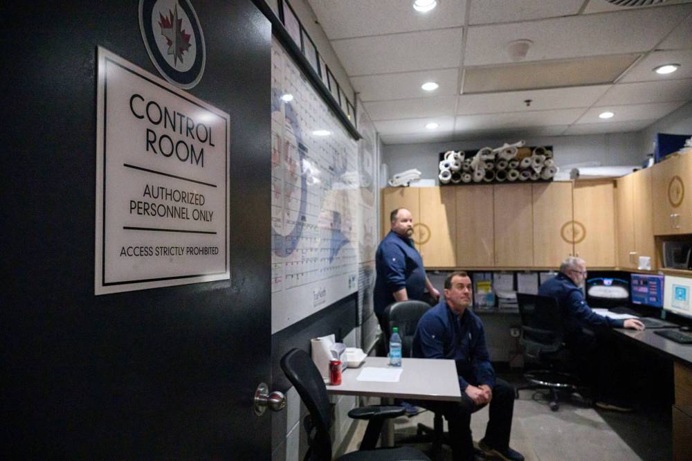 MIKE SUDOMA / FREE PRESS
Crew members closely monitor ice temperatures and other data points during the game and keep an eye out for chips and bumps in the ice that may need to be addressed between periods.