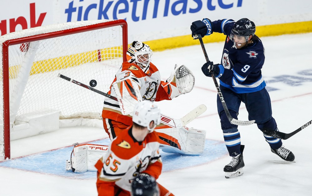 John Woods / THE CANADIAN PRESS
Jets winger Alex Iafallo goes to the Anaheim net and tips the puck in front of Ducks goalie Ville Husso on Wednesday during third-period action in Winnipeg.