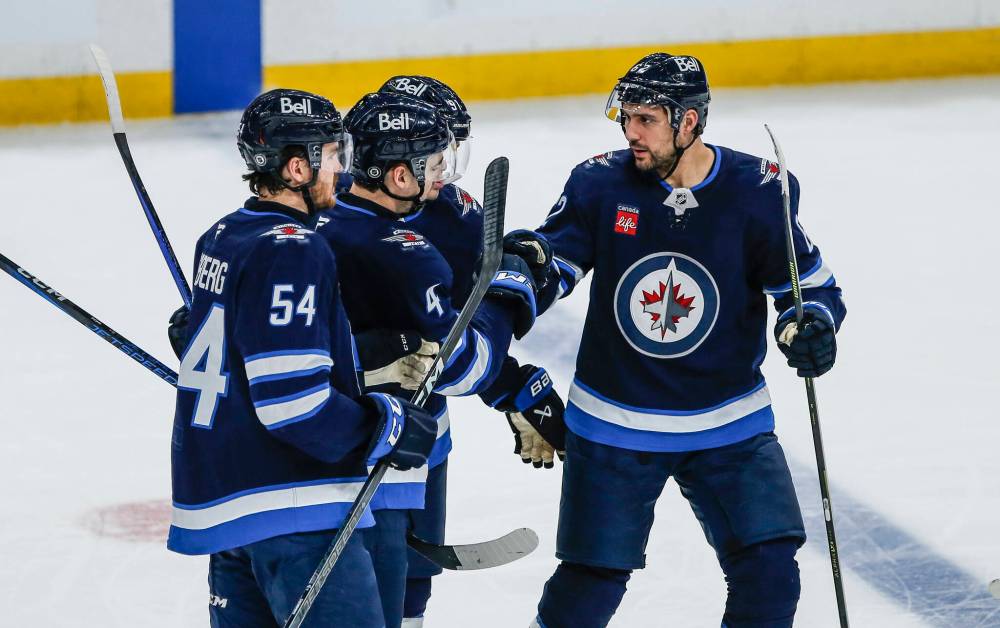 John Woods / THE CANADIAN PRESS
Winnipeg Jets Dylan Samberg, Neal Pionk, Cole Perfetti and Nino Niederreiter celebrate Pionk’s goal against the Anaheim Ducks during the second period of the Jets’ 2-1 OT win in Winnipeg on Wednesday.
